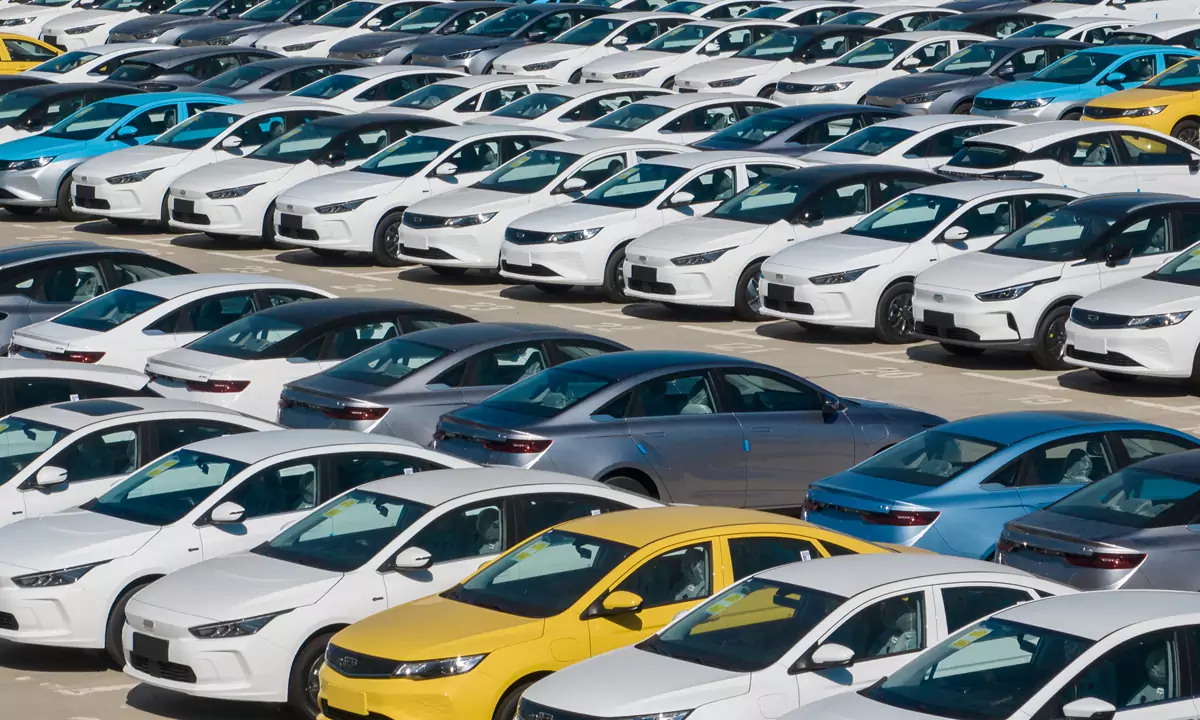 Parked Geely new cars of different colors.