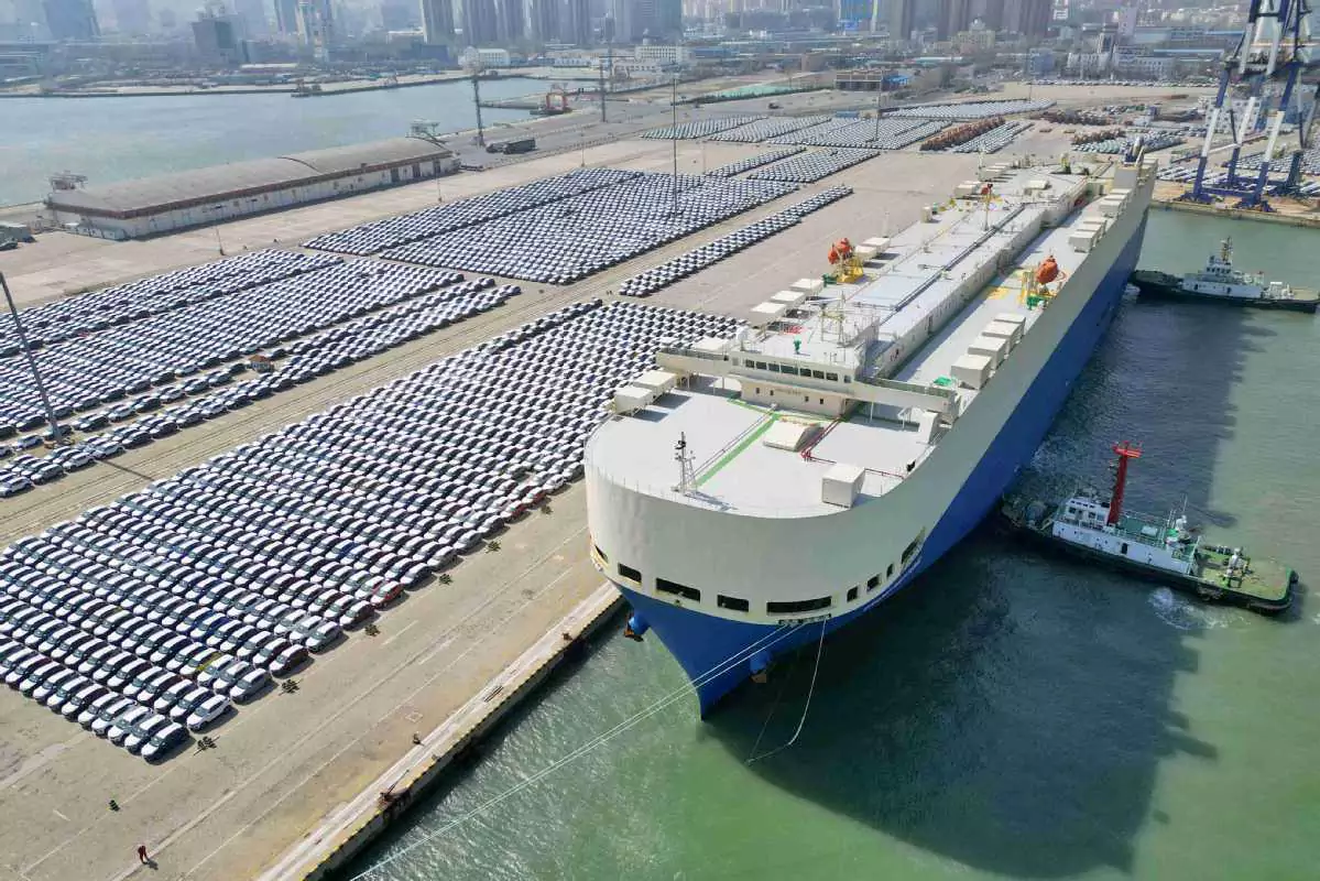 Roll-onRoll-off (Ro-Ro) ships and cars awaiting loading.