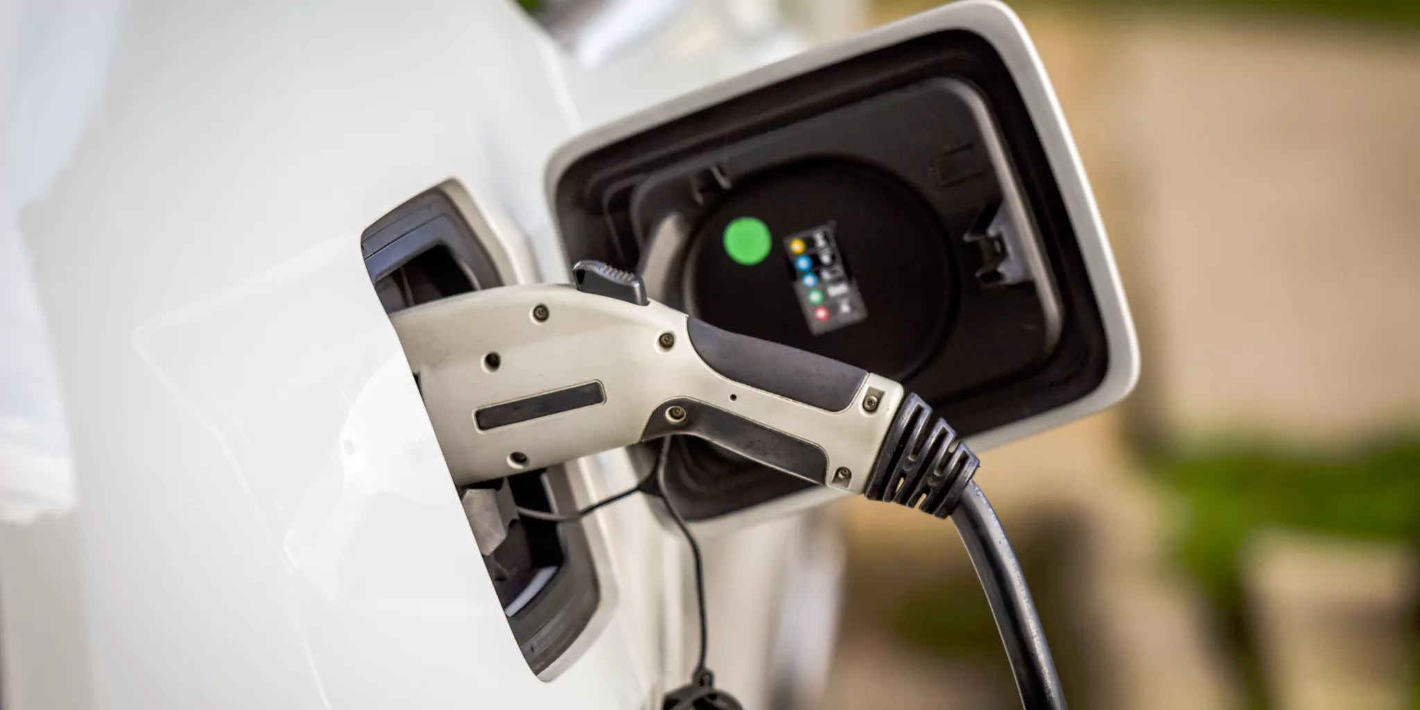 A charging gun charging an electric car