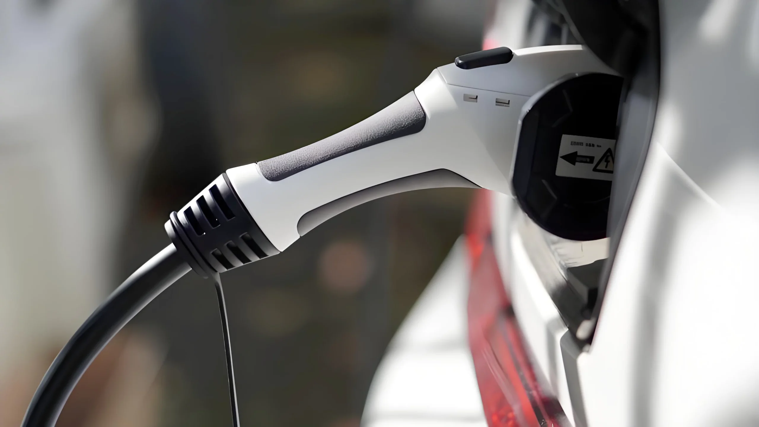 A charging gun is charging a car